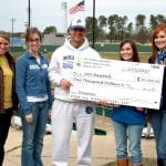 Southern Arkansas University Head Baseball Coach Allen Gum accepts a $1,000 donation to the Mulerider baseball program from the SAU President’s Ambassadors. Representing the Ambassadors are, from left, Elizabeth Myrick, Geurin Smith, Kacey Richardson and Heather Rochelle. The President’s Ambassadors operate the concession stand during home baseball games. When the University hosted the NCAA Division II South Region Baseball Tournament in 2009, the group cleared extra profits. To show appreciation to the baseball team for allowing them to operate the concession stand, the Ambassadors decided to donate some of that profit back to the baseball program.