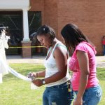 Students Looking at Clothesline SAU students view the Clothesline Project during its 2010 exhibit.