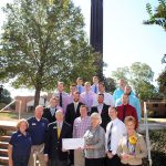 Dr. David Rankin, president of SAU, receives a check for $18,475 from Julia Laney Machen and the brothers of Phi Lambda Chi Fraternity to restore the bells in the SAU Bell Tower.