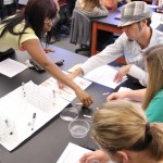 Genetics students practice mapping karyotypes, as they will do with their own DNA once their blood samples are processed.